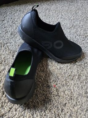 Oofos Casual Black Slip-On Sneakers with Bright Green Insole